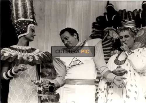 BW Photograhy of Coluche, Mimi Coutelier and Michel Serrault in "Deux heures moins le quart avant Jésus-Christ" by Jean Yanne - 1982